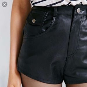 Black faux leather pins and needles shorts